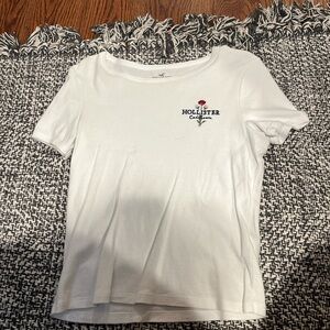 white baby tee hollister with flower detail